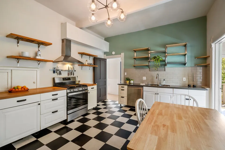 Kitchen with open shelving and checkerboard floor