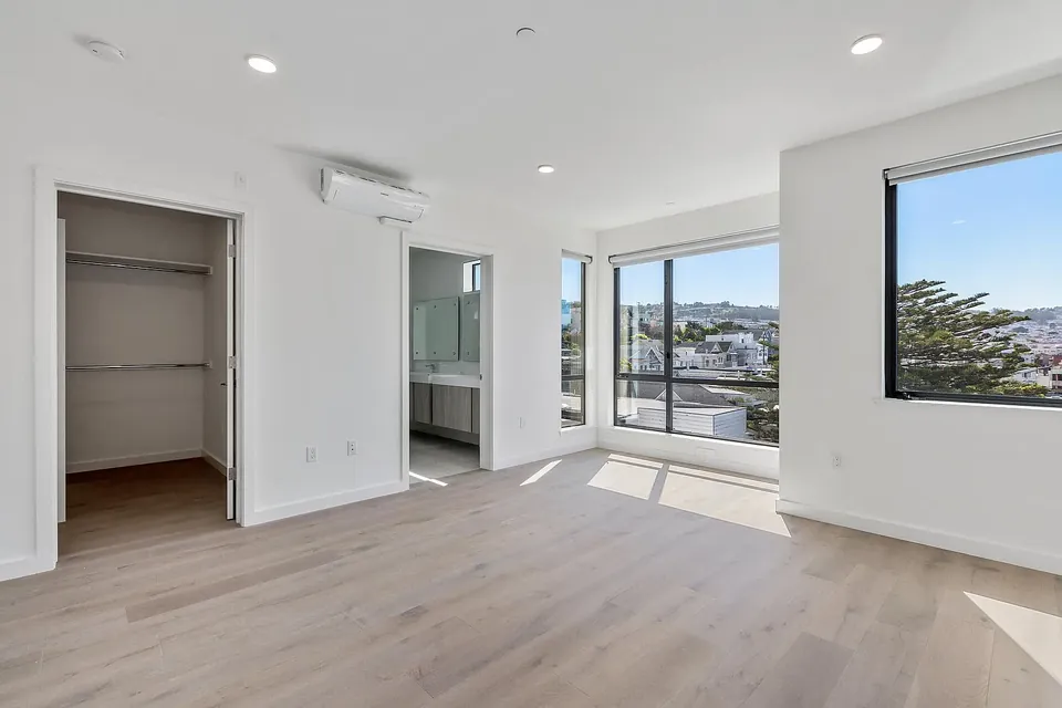 Bedroom with walk-in closet and ensuite bath