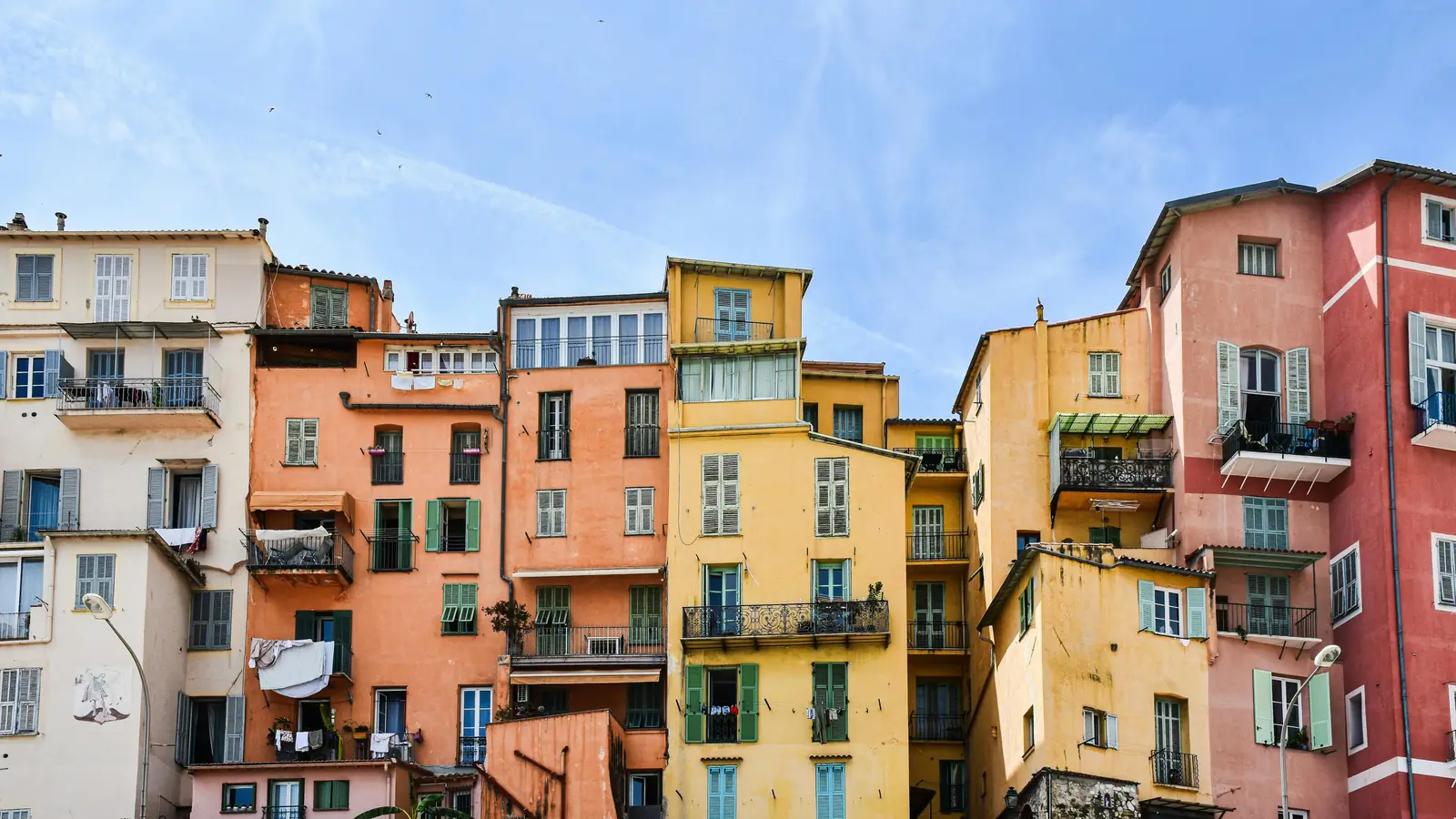 Colorful facades with shutters and balconies in Menton