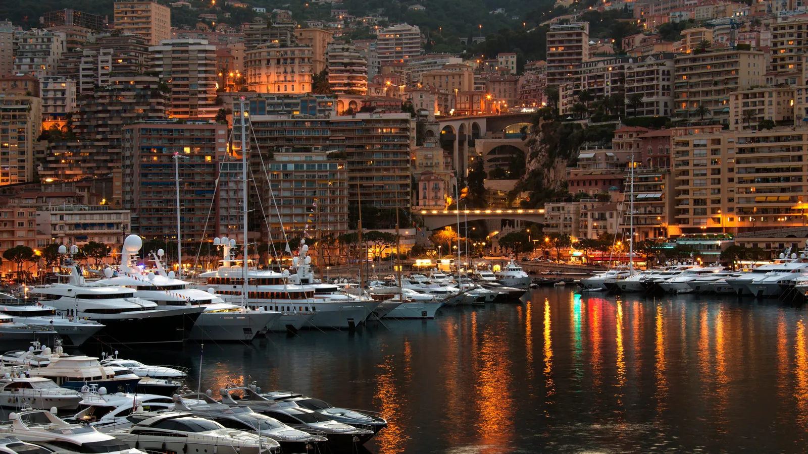 Port Hercule and La Condamine at night, with lights reflected in the harbor
