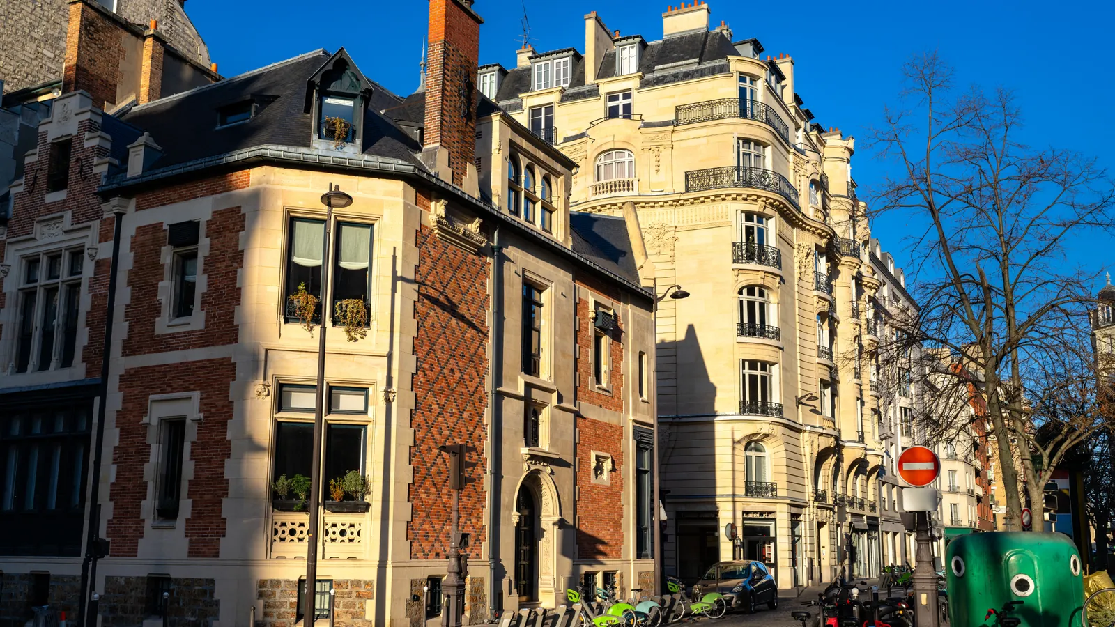 Brick and stone apartment buildings on a residential street in western Paris