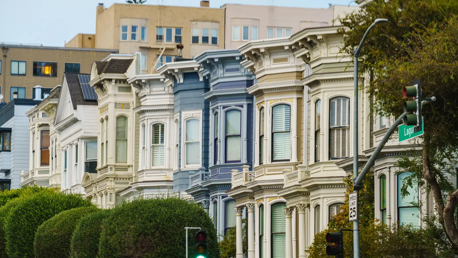 A row of Victorian houses with bay windows in San Francisco